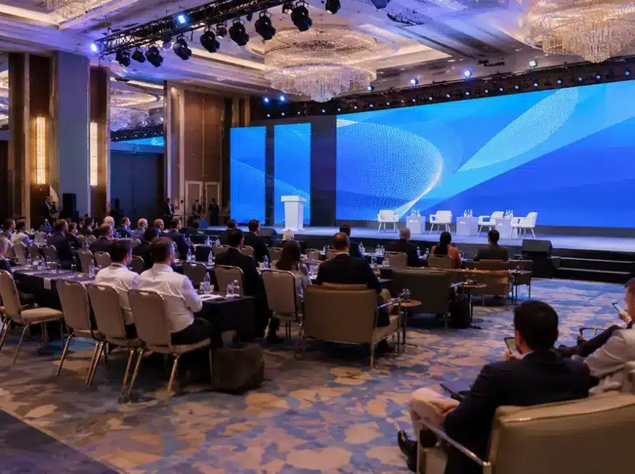 Corporate conference event production in Antalya, Turkey with a large LED screen, stage lighting and professional seating layout