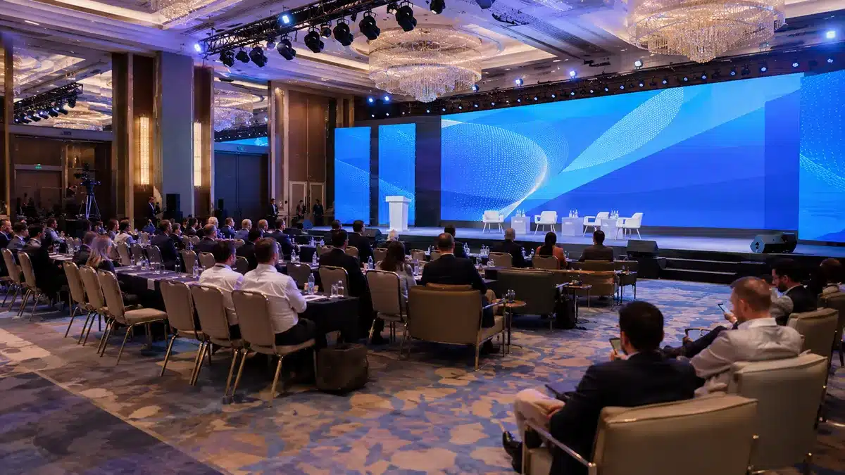Corporate conference event production in Antalya, Turkey with a large LED screen, stage lighting and professional seating layout